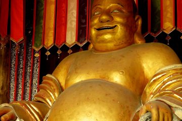Hotei Buddha statue at Tenno-den Hall