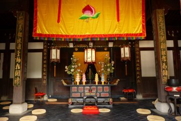 Inside of Kaizan-do Hall with a peach embroidered banner