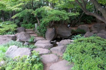 Stone pathway around the pond in Heisei Garden