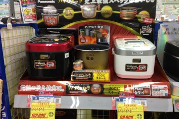 <p>Japanese prefer domestic grown rice cooked in premium domestic made rice cookers, like these models that top out at 100,000 yen ($1,010 U.S).</p>