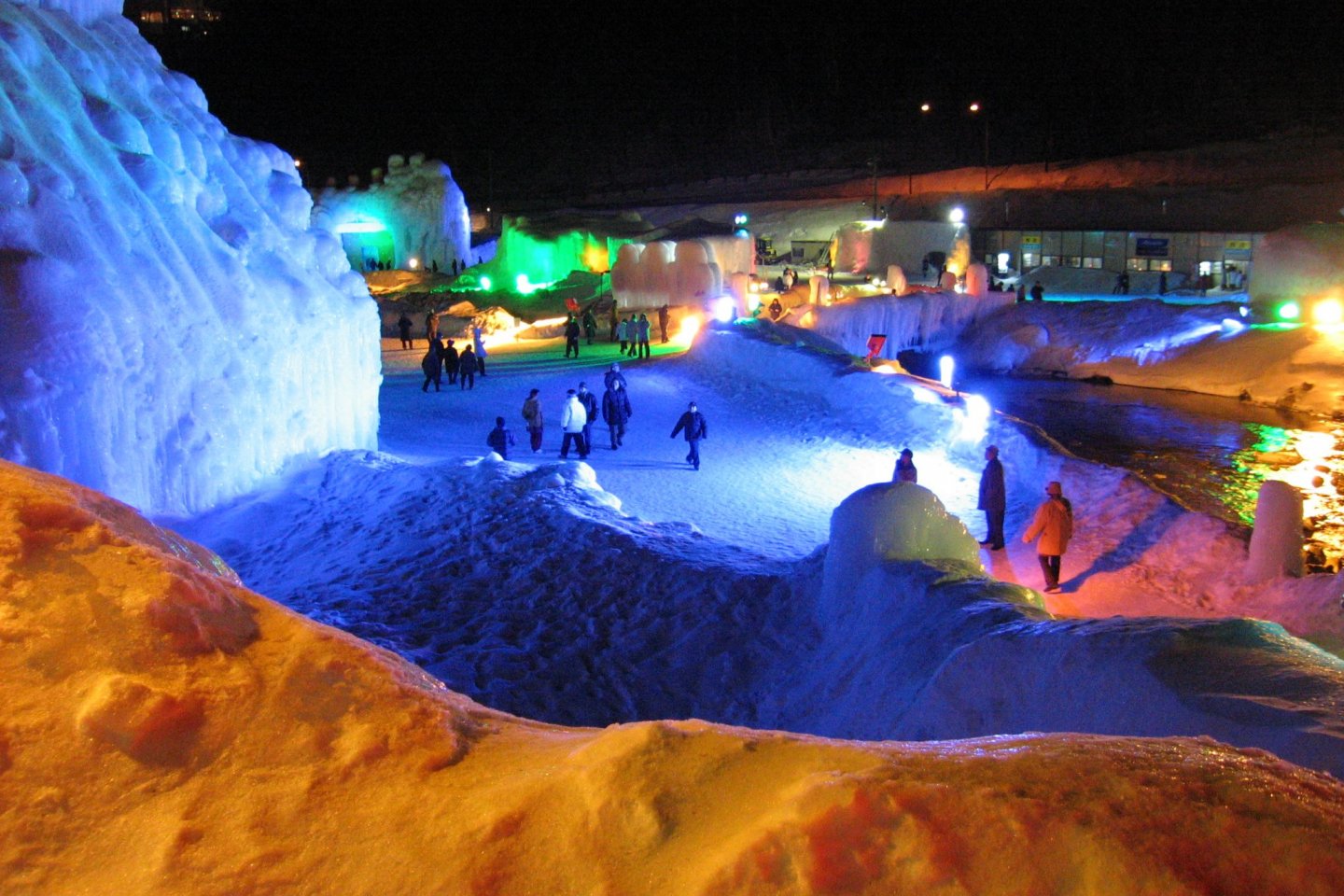 Colorful lights illuminating the ice sculptures