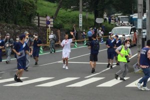 Olympic torch runner coming from Koma Jinja