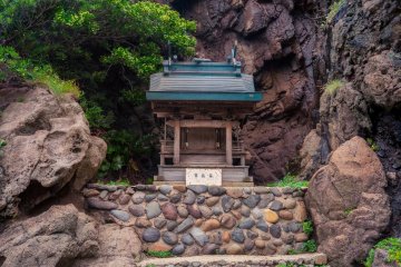 A shrine buried among the rocks near Kuniga Beach.