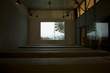 A film shows footage from Japan's involvement in war during the 20th Century. This was only display of the imperial flag I saw