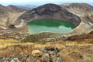 The emerald green of Okama Crater