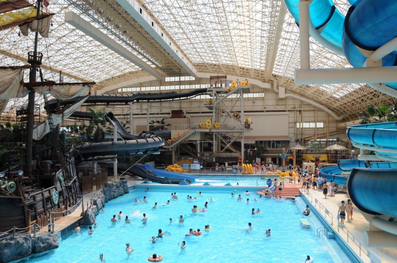 The indoor water park's wave pool and slides