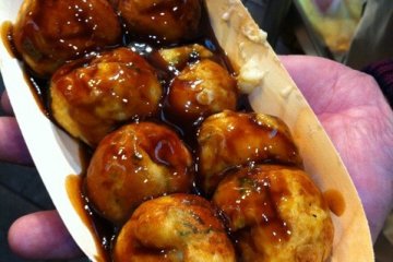 Takoyaki (octopus dumplings)! Takoyaki was first popularized in Osaka, home of 'street food.'