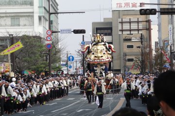 A float is pulled down the main street in Karatsu