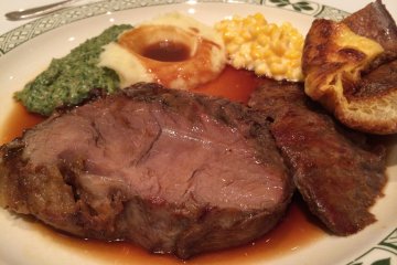 Aged prime rib roasted to perfection, medium-well, with creamed spinach, mashed potatoes and gravy, creamed corn & Yorkshire pudding