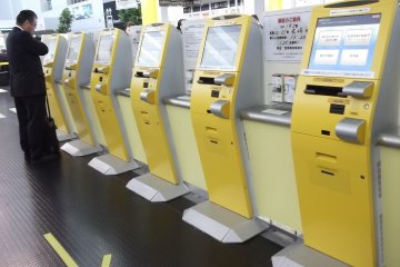 <p>Self check-in machines at Kobe Airport</p>