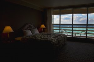 My bed, the balcony and the blue ocean right in front of me