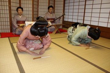 <p>Song by geigi Fu Chiyo, on shamisen geigi&nbsp;Madoka, both bowing beautifully after a performance</p>