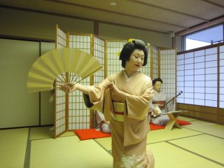 Awara Geisha, Ms. Shiori, dancing gracefully with open fan