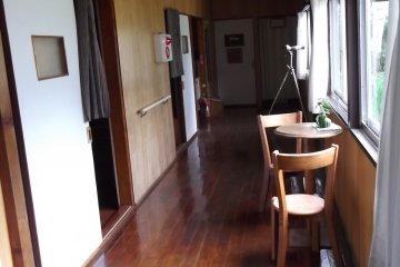 <p>The corridor on the mens&#39; side of the hostel: rooms on the left, bathroom at the end</p>