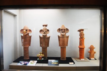 <p>Smiling Haniwa, you can see the small Honjo&nbsp;City mascot beside&nbsp;the second Haniwa</p>