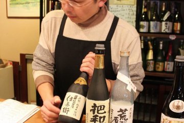 <p>At the tasting counter, request the sake tasting course then decide which three sake to sample. Sake is poured from subtle to strong taste, often indicated by the drink&#39;s color</p>